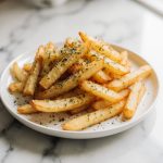 Wie lange brauchen rohe Kartoffeln in der Heißluftfritteuse? Schnelle Antwort hier!